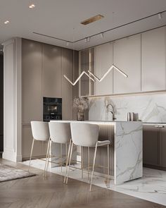 a kitchen with marble counter tops and white chairs