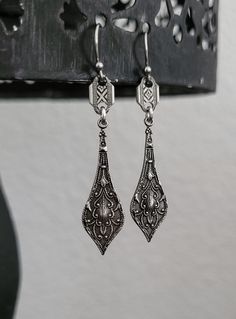 Adorn yourself with these antique silver plated drop earrings with a beautifully detailed metalwork. These earrings are 1 3/4 inches long.  Stainless steel earwires.  Lightweight  All my jewelry is free of lead, free of nickel and made in the USA.  Eco friendly metals .    I source all materials from the USA, Italy, Portugal, Spain and The United Kingdom.  All my jewelry is designed for you to express yourself and your life with a soulful and meaningful purpose. Ornate Antique Silver Nickel-free Jewelry, Silver Chandelier Earrings With Intricate Design For Formal, Elegant Engraved Metal Earrings, Elegant Oxidized Chandelier Earrings For Weddings, Vintage Antique Silver Dangle Earrings, Silver Vintage Chandelier Earrings For Formal Occasions, Antique Silver Vintage Drop Earrings, Silver Teardrop Earrings With Oxidized Finish As Gift, Vintage Silver Chandelier Earrings For Formal Occasions