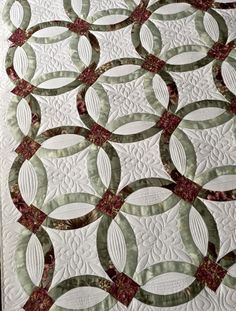 a quilted wall hanging with circles on it