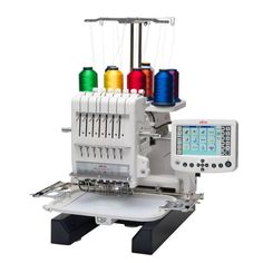 a machine with four different colors of thread on it