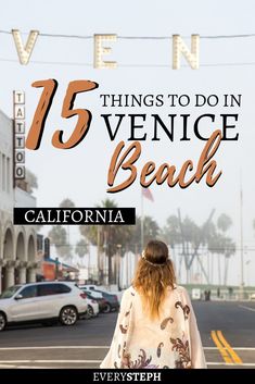 a woman walking down the street in front of a sign that says 15 things to do in venice beach, california