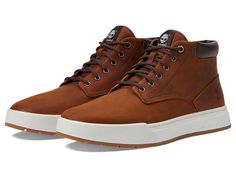 Timberland Maple Grove Leather Chukka - Men's Shoes : Medium Brown Full Grain : Feel a fresh natural vibe in every step wearing the Timberland Maple Grove Leather Chukka Footwear. Upper made with premium Timberland leather. Ethylene vinyl acetate insole. ReBOTL fabric lining. Round toe silhouette. Lace-up style. Padded tongue and collar for added comfort. Branding on tongue. Rubber midsole. Rubber outsole. Imported. Weight of footwear is based on a single item, not a pair. Measurements: Heel Height: 0.75 in Weight: 1.5 lb Brown Low-top Boots With Cushioned Footbed, Rugged High-top Timberland Sneakers, Rugged Brown Moc Toe Sneakers, Rugged Brown Sneakers With Round Toe, Low-top Timberland Boots With Rubber Sole, Timberland Low-top Boots With Rubber Sole, Timberland Leather Low-top Boots, Brown Moc Toe Sneakers With Leather Footbed, Brown Leather Footbed Sneakers For Outdoor