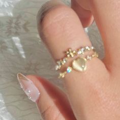 📌 Please Note: When adjusting the ring, please squeeze or expand the ring body slowly and gently. 💎 Materials: 14k Gold Electroplated - more durable than regular platings Cubic Zirconia Cat's Eye Opal Pearlescent Beads 📐 Size: Adjustable Open Design - Size 5+ Opal Heart Ring, Romantic Jewellery, Floral Heart, Open Design, Ring Bracelet, Earring Necklace, Ring Necklace, Heart Ring, Cubic Zirconia