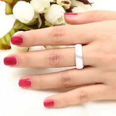 This stunning white ceramic ring features sparkling pavé crystals, making a fabulously unique ring to symbolize your Aromantic pride. A white ring worn on the left middle finger is a universally accepted way, within the LGBTQIA+ community, to represent anyone on the Aro-spectrum, while still maintaining subtlety. This is the opposite of the black ring on the right middle finger, that symbolizes anyone on the Ace-spectrum. While any individual may identify as either one, or both, Asexuality and A White Diamond Enamel Ring, Aromantic Ring, Modern White Diamond Ring For Wedding, Modern White Diamond Ring With Accents, White Diamond Enamel Wedding Ring, Modern White Rings For Anniversary, Modern White Diamond Promise Ring, Modern White Jewelry For Promise, Modern White Promise Jewelry