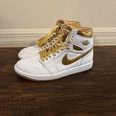 Air Jordan 1 Retro High Og White/Gold Womens Size 7 Fd2596-107 Nike Gold Sneakers For Streetwear, Gold Lace-up High-top Sneakers For Streetwear, Gold Sneakers With Boost Midsole And Round Toe, Gold Sports Sneakers With Laces, Sporty Gold High-top Custom Sneakers, Gold High-top Sporty Sneakers, Gold High-top Sneakers With Gum Sole, Nike Gold Sneakers With Boost Midsole, Nike Gold High-top Sneakers