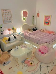 a room with two beds, chairs and stuffed animals on the floor