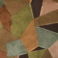 a multicolored area rug with different shapes and sizes