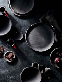 an assortment of dishes and utensils on a table