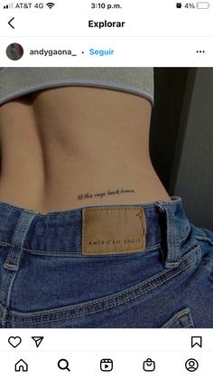 the back of a woman's stomach with an inscription on it