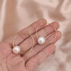 Type:    PEARL LARGE HOOP EARRINGS Feature:  30mm Hoops with Large Round 11-12mm Freshwater Round Pearls Pearl color:Natural white Pearl size:11-12mm  Pearl shape:Round Pearl luster: Very high Pearl blemish: 85% free Material:   14K Gold Plated on Brass Please Note: Due to the variance of the natural pearls, size measurement is approximate, and color may vary a little. Nickel-free White Hoop Pearl Earrings, Nickel-free Pearl White Round Jewelry, Nickel Free Pearl White Jewelry, Hypoallergenic Round Pearl Earrings For Party, Nickel-free Round Pearl Earrings For Weddings, Nickel-free Round Earrings For Wedding, Round Pearl Nickel-free Wedding Earrings, Round Pearl Earrings Nickel-free For Weddings, Minimalist Round Pearl Earrings For Party