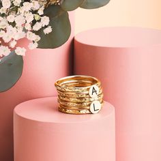 Looking for a unique and special gift? Or maybe you're just treating yourself? Either way, our Initial Stacking Rings Set of 7 in Gold, Silver, or Rose Gold is sure to fit the bill! Personalize these gorgeous rings with any uppercase letter in an arial-style font, making them perfect for representing yourself or your loved ones. The set comes with two initial rings and five heavy weight "Raw Silk" stackers, all in your choice of Sterling Silver, 14K Yellow Gold Fill, or 14K Rose Gold Fill. Stack