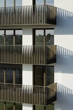 an apartment building with balconies and balcony railings