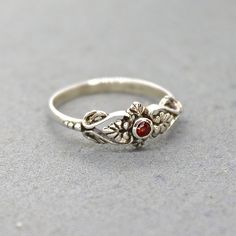 "Garnet silver ring for women, Victorian silver ring, Great everyday ring. Also available with Opal, Zircon and in gold plating or real solid 14k gold 🌸 Features: Handmade ring 🌸 Measurments: Weight - 1.3g Width - 0.27\" (7 mm) Stone diameter - 0.07\" (2 mm) 🌸Materials: Sterling Silver Garnet 🌸 More info: All my jewelry is carefully wrapped and shipped in a lovely gift box, ready to be given as a gift. ♥ For the same ring in 14k gold, click here: https://www.etsy.com/il-en/listing/758212463/ Old Rings Vintage Silver, Antique Silver Ring, Red Sterling Silver Flower Ring As Gift, Vintage Sterling Silver Stackable Rings Gift, Silver Ruby Birthstone Open Ring, Silver Open Ruby Ring With Birthstone, Silver Birthstone Toe Ring For Anniversary, Silver Sterling Ruby Ring For Wedding, Dainty Silver Ruby Ring With Birthstone