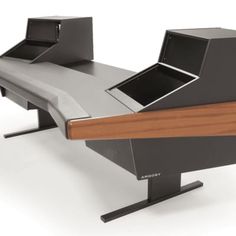 an office desk that is made out of metal and has a monitor on it's side