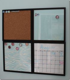 a bulletin board mounted to the wall with magnets on it