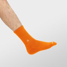 Classic crew socks for a clean look. Single set of socks in orange. Stay focused and fly everyday in APTHCRY® essentials collection. As stylish as they are functional, and backed by thoughtful craftsmanship, these socks provide maximum comfort and breathability. APTHCRY® socks feature our signature Iso-Weave mesh triangles, ribbed finishing, and arch support that will keep your feet cool, happy, and your style in check. Iso-Weave Technology Classic Crew socks Easy care cotton blend Ribbed finish