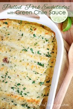 baked enchiladas with creamy green chile sauce in a casserole dish