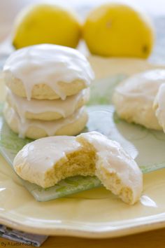 lemon cookies with white icing on a plate