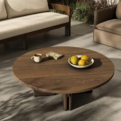 a coffee table with two lemons on it