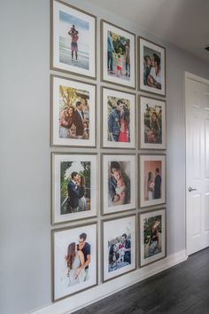 a wall with many pictures hanging on it