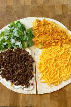 a tortilla with cheese, lettuce and other toppings on it