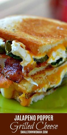 a grilled cheese and bacon sandwich on a green plate