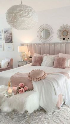 a bedroom with pink and white decor on the walls