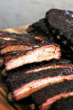 sliced up meat sitting on top of a cutting board