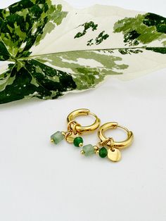 18K gold pated stainless steel hoop earrings with green natural stone charms. Waterproof and hypoallergenic. Vintage look. Can be your daily piece of jewellry or a wonderful gift for your loved ones. Comes with pleasing micro fibre suede jewellry pouch. All Australian orders include free untracked postage. Trendy Green Huggie Earrings For Everyday, Modern Charms Earrings For Gift, Green Metal Hoop Earrings As A Gift, Modern Charm Earrings For Gifts, Modern Green Hoop Earrings As Gift, Green Tarnish Resistant Hoop Earrings For Gift, Green Tarnish Resistant Huggie Earrings For Gifts, Dainty Green Huggie Earrings As Gift, Green Huggie Earrings As May Birthstone Gift