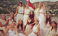 a group of women sitting on top of a boat