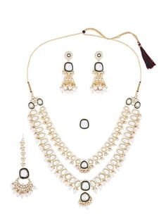 This jewellery set consists of a gold-toned, white & green necklace and a pair of earrings The gold-plated necklace, has white kundan-studded details, secured with a drawstring closure A pair of matching earrings, each secured with a post and back closure Comes with matching mang tikka secured with hook closure Comes with matching finger ring, secured with slip-on closure Size & Fit Necklace Length- 62 cm Earring Length- 8.5 cm Maangtikka Length- 3.5 cm Ring Diameter- 2 cm (Adjustable) Product Weight- 189 grams Material & Care Material: Alloy Plating: Gold-Plated Stone-type: Kundan Care Instructions: Wipe your jewellery with a soft cloth after every use Always store your jewellery in a flat box to avoid accidental scratches Keep sprays and perfumes away from your jewellery Do not soak your Festive Gold Plated White Bridal Necklace, Festive White Gold Plated Necklaces, Festive White Gold Plated Bridal Necklace, Festive White Gold Plated Jewelry, Festive White Gold-plated Bridal Necklace, Festive White Gold-plated Jewelry, White Gold Plated Chandbali Necklace, White Gold-plated Chandbali Necklace, White Meenakari Gold Plated Necklace