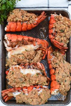 baked stuffed lobsters in a pan with text overlay that reads the fastest baked stuffed lobster