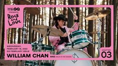 a woman playing drums in front of a pink and white poster with the words rock love written on it