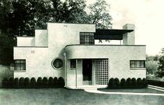 an old black and white photo of a house