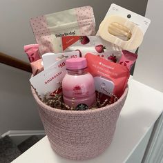 a pink basket filled with personal care items