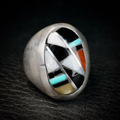 Wonderful Vintage Zuni Ring by Ralph and Lillie Kallestewa, they have been active jewelers since the 1950s.This ring is a  Multi Stone Sterling Silver Inlay, with Turquoise, Jet, Mother of Pearl and Coral.  This ring will look great on both men and women. Size 10 1/2 Measures 1 " tall Weight 18.9 grams Collectible Multi-stone Turquoise Oval Ring, Vintage Sterling Silver Turquoise Ring With Polished Finish, Multicolor Inlay Rings For Anniversary, Artisan Rings With Inlay For Anniversary, Anniversary Multicolor Inlay Rings, Vintage Sterling Silver Turquoise Ring With Inlay, Collectible Vintage Turquoise Ring With Polished Finish, Vintage Turquoise Ring With Polished Finish, Southwestern Style Rings With Inlay