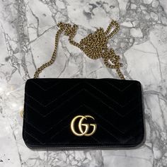 Gucci Marmont Mini Black Gg Velvet Cross Body Bag Black Velvet/Pink Interior Magnetic Closure Gold Chain Outside Of Bag In Excellent Condition Interior: Slight Pen Mark On Interior Slight Scuffing Of Leather On Flap Of Bag-See Pics Dust Bag Beautiful Classic Crossbody See Pics. This Is Not A Brand New Bag. This Is A Used Bag In Good Condition Gucci Marmont Mini, Cross Body Bag Black, Velvet Pink, Gucci Marmont, Pink Interior, Cross Body Bag, New Bag, Magnetic Closure, Body Bag