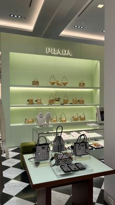 a display in a store filled with lots of purses and handbags on tables