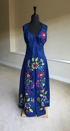 Blue Sleeveless Maxi Dress With Floral Embroidery, Blue Cotton Maxi Dress With Floral Embroidery, Spring Embroidered Blue Maxi Dress, Vintage Blue Embroidered Dresses, Embroidered Blue Maxi Dress For Summer, Blue Embroidered Floor-length Maxi Dress, Fitted Embroidered Blue Maxi Dress, Fitted Blue Embroidered Maxi Dress, Fitted Blue Maxi Dress With Floral Embroidery