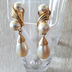 A lovely pair of vintage clip on earrings with faux pearls and goldtone metal in very good condition. Classic and timeless elegance. Measurements are in centimetres, they have a 4cm drop. Formal Gold Pearl Drop Clip-on Earrings, Vintage Pearl Clip-on Earrings For Formal Occasions, Vintage Pearl Clip-on Earrings, Vintage Formal Clip-on Earrings With Pearl Drop, Vintage Formal Clip-on Pearl Drop Earrings, Vintage Formal Pearl Drop Clip-on Earrings, Vintage Pearl Clip-on Earrings For Wedding, Vintage Gold Pearl Clip-on Earrings, Vintage Pearl Drop Clip-on Earrings For Formal Occasions