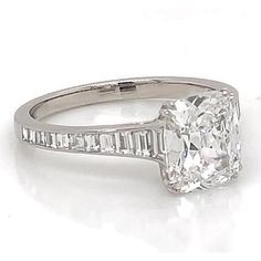 an oval cut diamond ring with baguets