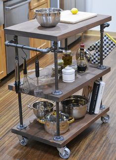 a kitchen cart with various cooking utensils on it