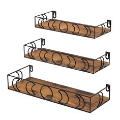 three metal and wood shelves with circles on them