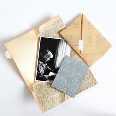 an open envelope with photos and papers on it