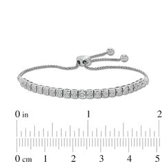 You’ll adore the sparkling and elegant look of this diamond line bolo bracelet. 10K white gold Features a row of 1/20 ct. diamonds, each shimmering in a square-shaped setting 1 ct. t.w. of diamonds 9.0-inch adjustable wheat chain bracelet; bolo clasp Channel Set Diamond Bracelet For Anniversary, Anniversary White Gold Channel Set Diamond Bracelet, Anniversary Diamond Bracelet Channel Set, Adjustable Tennis Bracelet With Vvs Clarity, Everyday White Gold Channel Set Jewelry, Adjustable Vvs Clarity Tennis Bracelet, Adjustable Diamond White Tennis Bracelet, White Gold Channel Set Tennis Bracelet For Anniversary, Adjustable Dazzling White Gold Tennis Bracelet