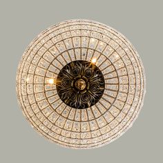 an overhead view of a chandelier with many lights in the center and circular design