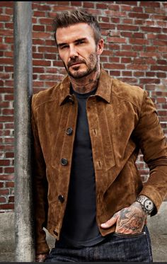 Elevate your style with this David Beckham brown suede trucker jacket! 🧥 Perfect for a casual day out or a ride, this jacket features a band collar and button closure. #DavidBeckham #MensFashion #SuedeJacket #VintageStyle #TheBombayLeatherCo 🍂❄️  #Designer Brown Collared Leather Jacket For Business, Business Suede Leather Jacket With Button Closure, Western Style Brown Leather Jacket For Winter, Brown Western Leather Jacket For Winter, Western Style Leather Outerwear With Button Closure, Collared Suede Leather Jacket In Casual Style, Brown Suede Outerwear For Business, Casual Suede Leather Jacket With Collar, Western Leather Outerwear With Button Closure