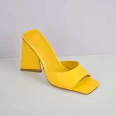 Yellow Open Heel Synthetic Sandals, Yellow Sandals With Padded Block Heel, Yellow Block Heel Sandals With Padded Heel, Yellow Summer Mules, Trendy Yellow Heels For Summer, Trendy Yellow Heels For The Beach, Chic Yellow Square Toe Sandals, Yellow Synthetic Mules With Round Toe, Trendy Yellow Leather Sandals