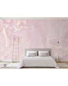 a bedroom with pink marble wallpaper and white bedding in front of a ladder