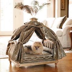 a dog laying on top of a bed in a living room